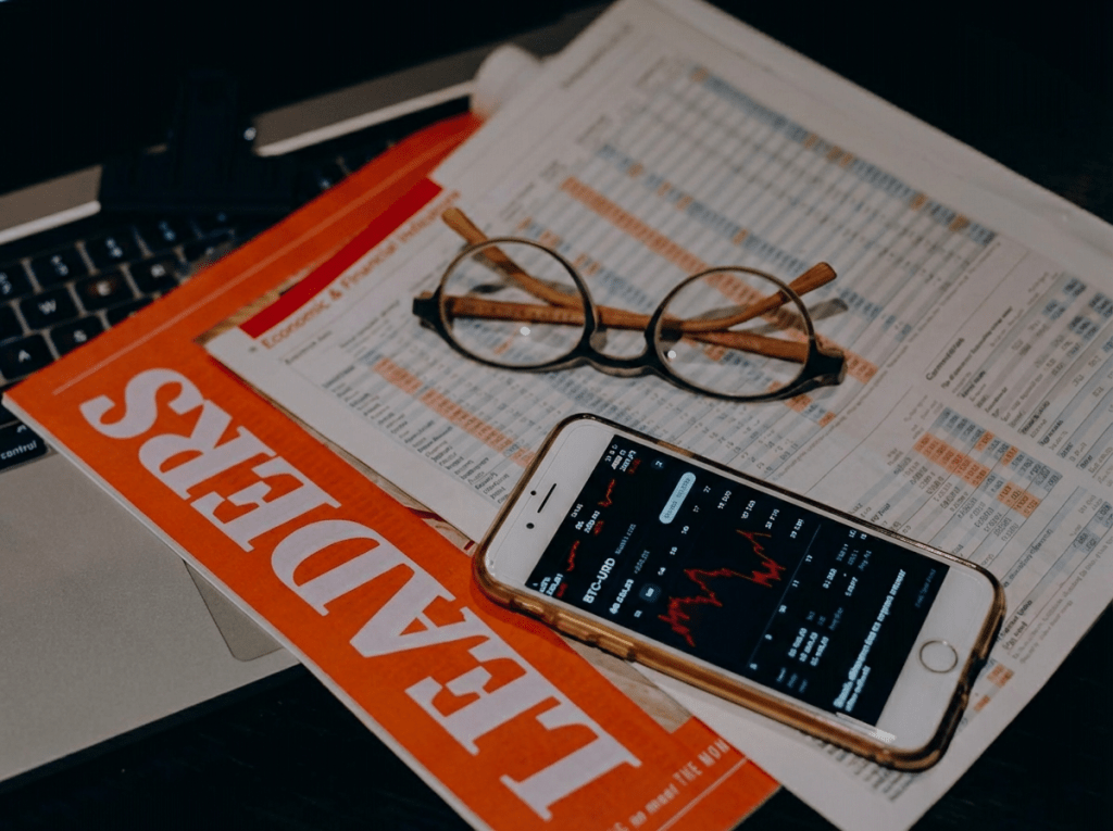 eyeglasses and smart phone on documents